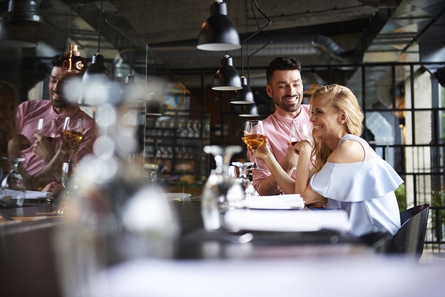 couple-laughing-together-restaurant-table-2022-03-04-01-51-16-utc.jpg